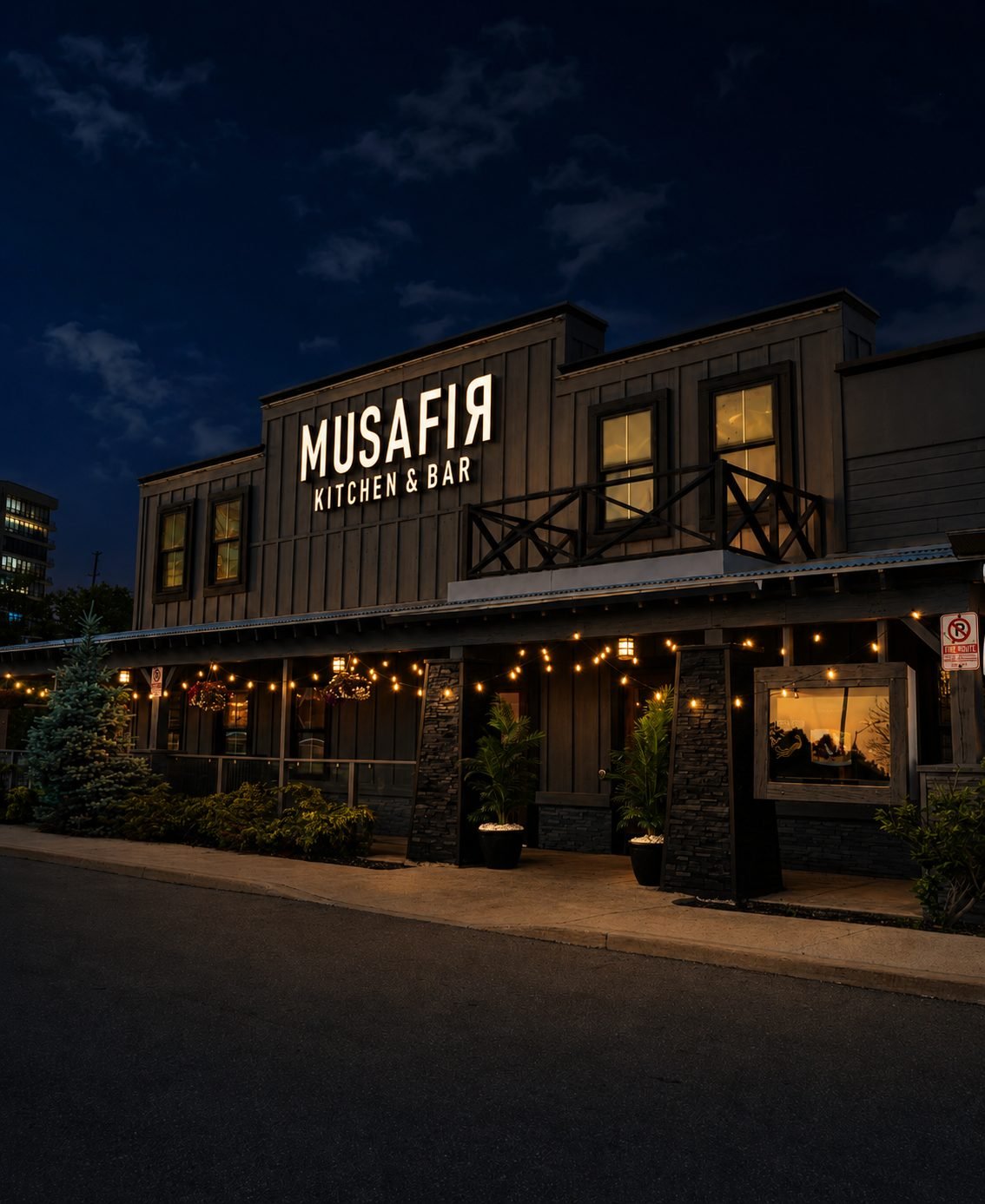 Musafir Kitchen & Bar restaurant exterior in Brampton, lit up at night